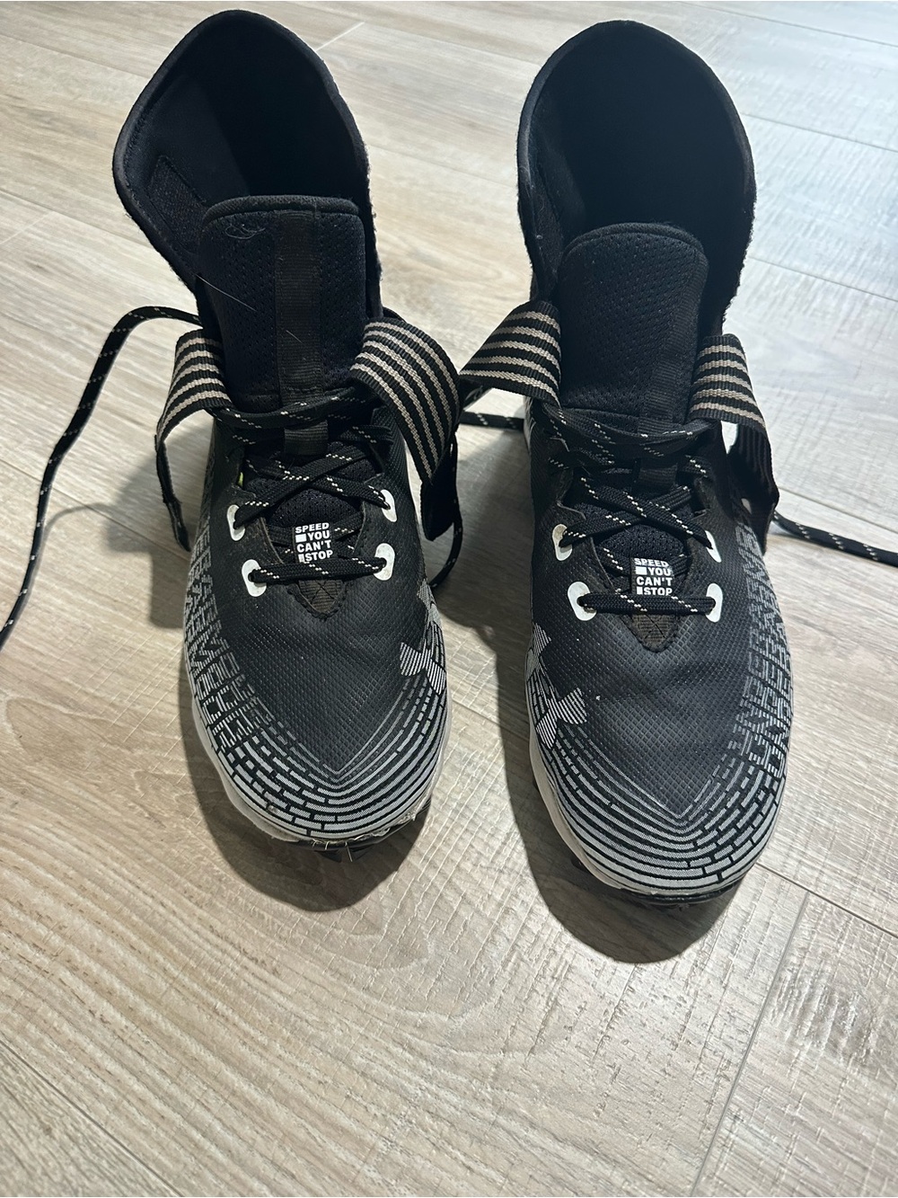 Under Armour Black and White football cleats